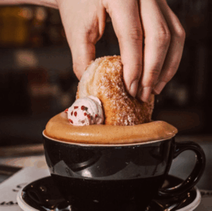 Steamhouse donut dunking in Beanworks coffee